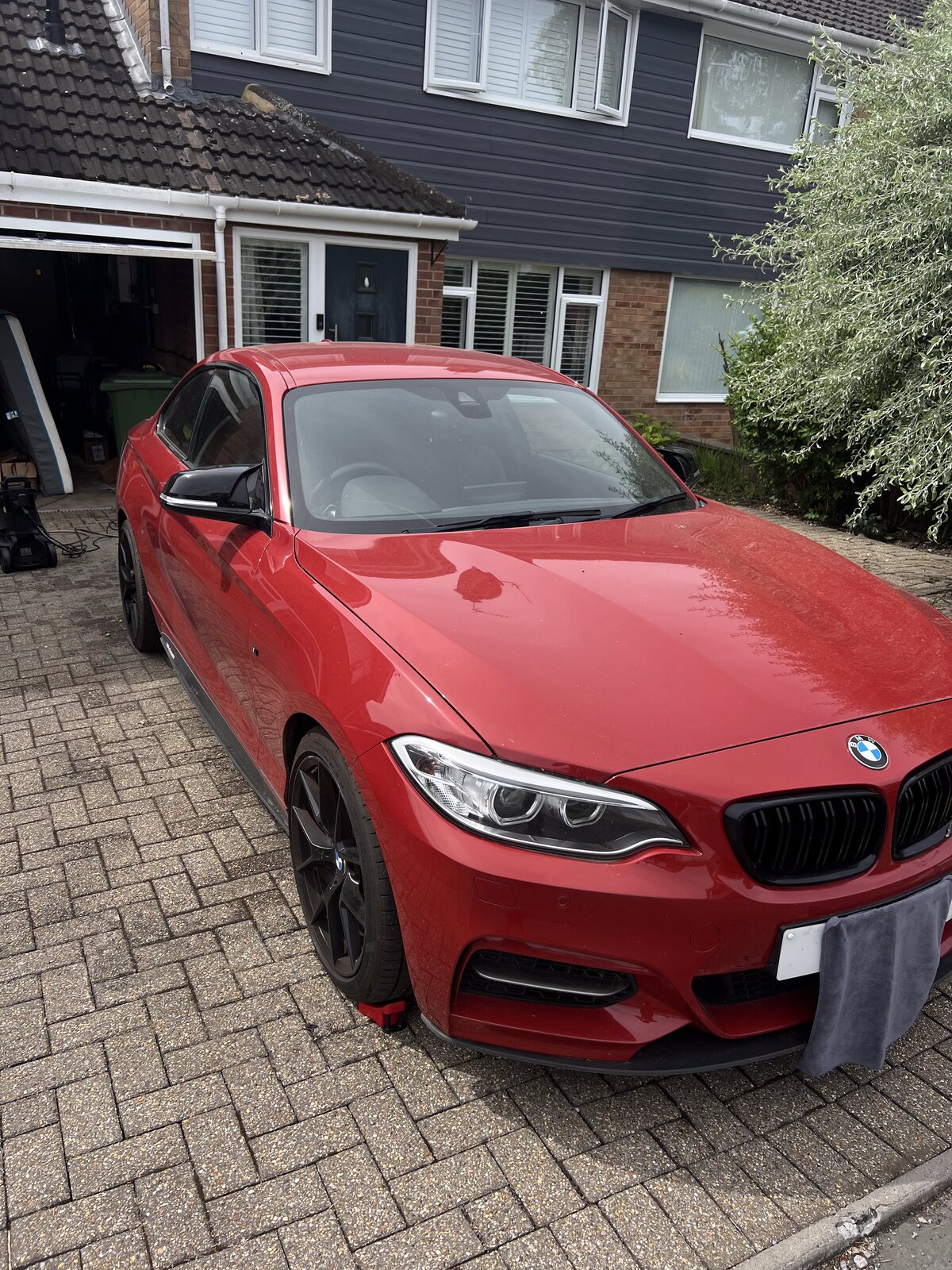 Red BMW M240i before detailing